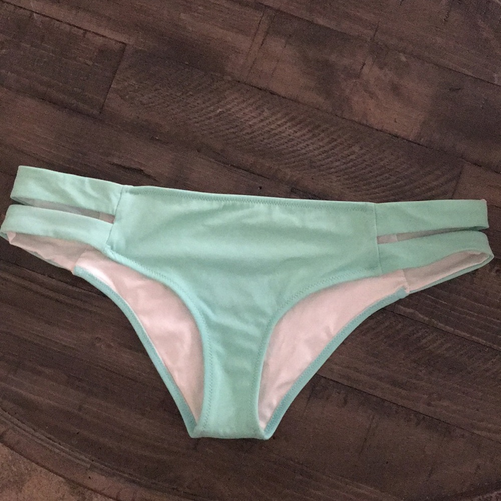 Green bikini bottoms by Victoria’s Secret.